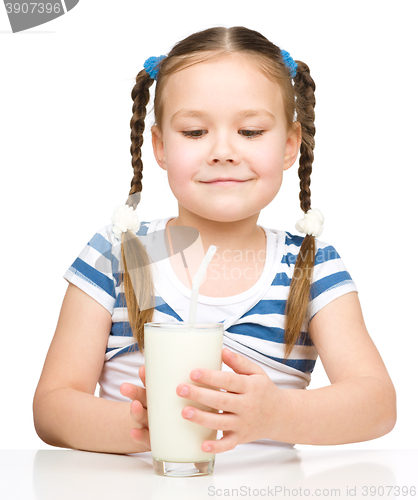 Image of Cute little girl with a glass of milk