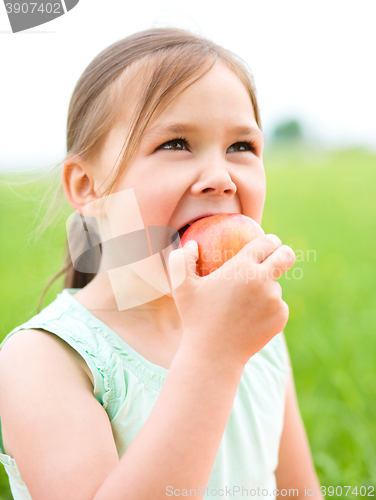 Image of Portrait of a little girl with apple