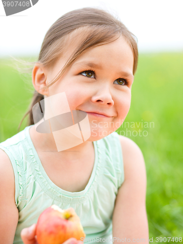 Image of Portrait of a little girl with apple