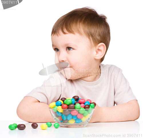 Image of Portrait of a boy with candies
