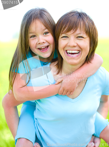 Image of Portrait of a happy mother with her daughter