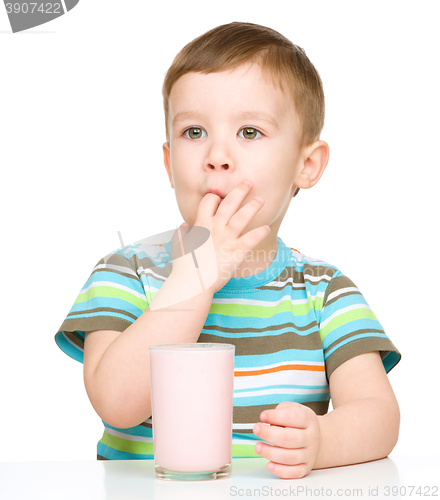 Image of Cute little boy with a glass of milk