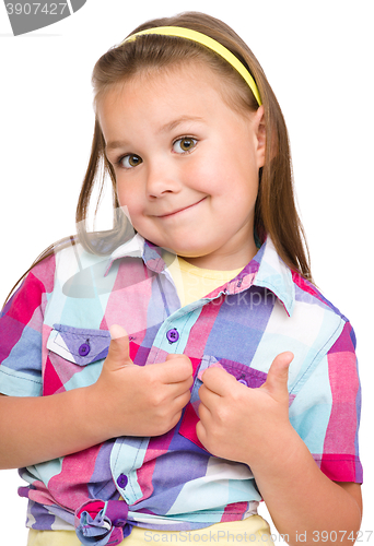 Image of Little girl is showing thumb up gesture