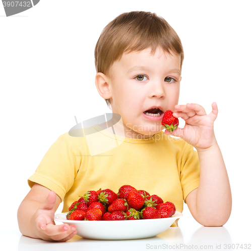 Image of Little boy with strawberries