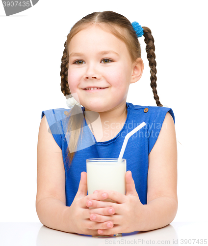 Image of Cute little girl with a glass of milk