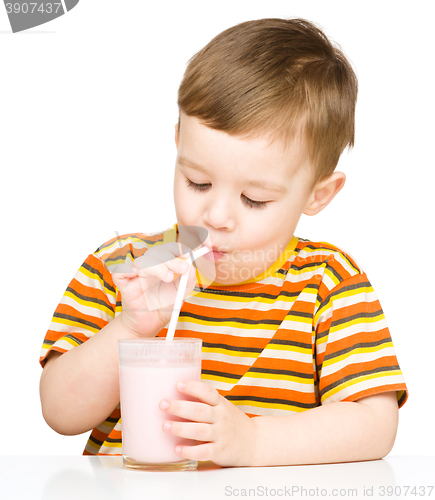 Image of Cute little boy with a glass of milk