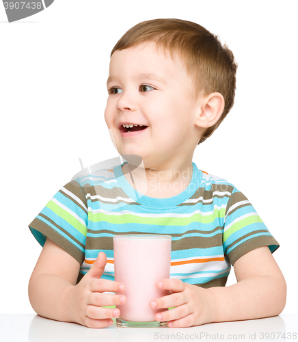 Image of Cute little boy with a glass of milk