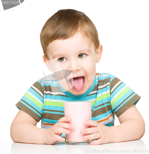 Image of Cute little boy with a glass of milk