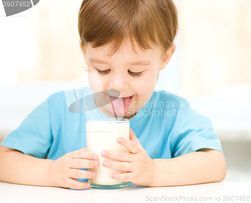 Image of Cute little boy with a glass of milk