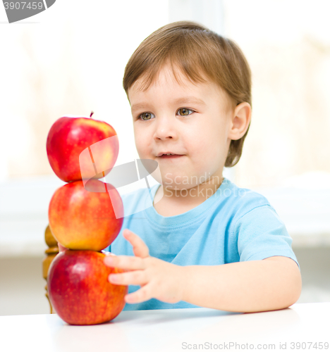 Image of Portrait of a little boy with apples