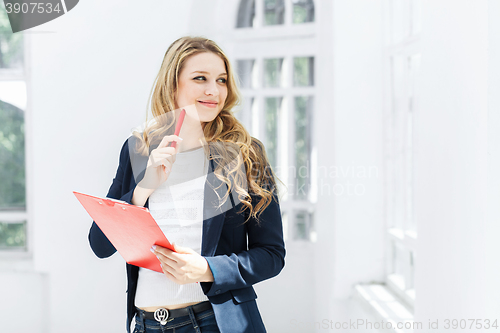 Image of The female worker against office