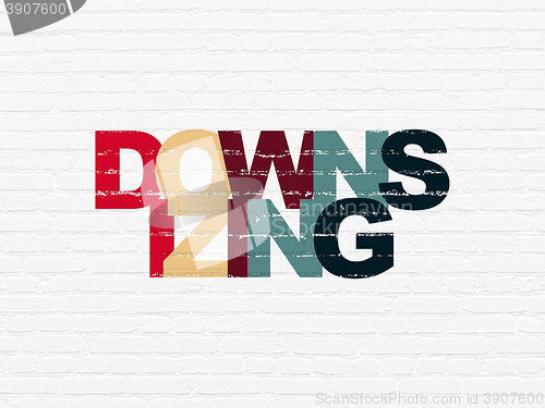 Image of Finance concept: Downsizing on wall background