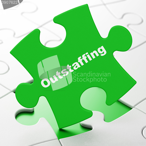 Image of Business concept: Outstaffing on puzzle background