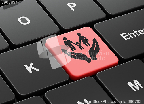 Image of Insurance concept: Family And Palm on computer keyboard background