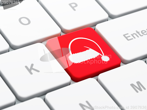 Image of Holiday concept: Christmas Hat on computer keyboard background