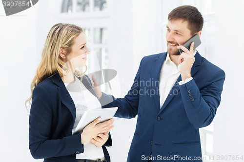 Image of Male and female office workers.