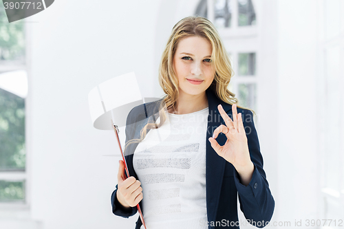 Image of The female worker against office