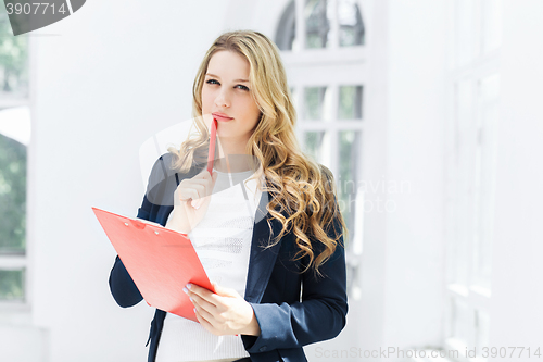 Image of The female worker against office