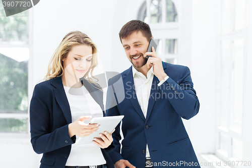 Image of Male and female office workers.