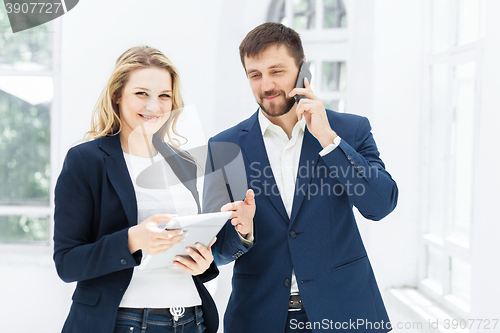 Image of Male and female office workers.