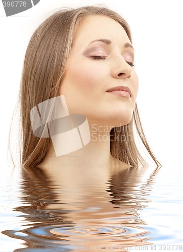 Image of beautiful woman with closed eyes in water