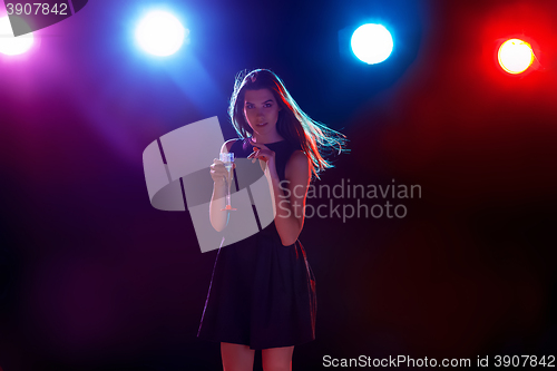 Image of The beautiful girl dancing at the party drinking champagne
