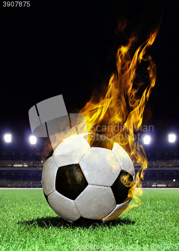 Image of fiery soccer ball on stadium