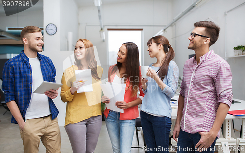 Image of creative team on coffee break talking at office