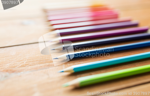 Image of close up of crayons or color pencils on wood