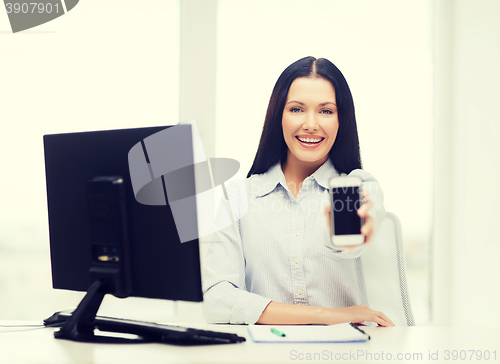 Image of smiling businesswoman or student with smartphone