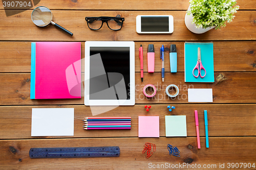 Image of close up of school supplies and tablet pc