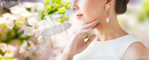 Image of close up of beautiful woman face with earring