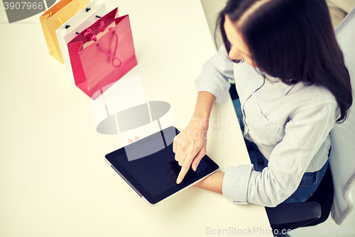 Image of close up of woman with tablet pc at office