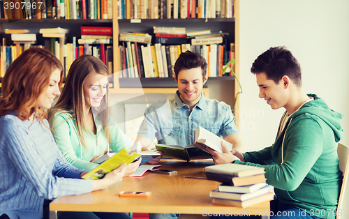 Image of students with books preparing to exam in library