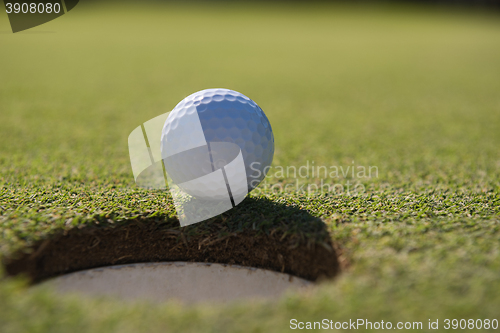 Image of golf ball in the hole