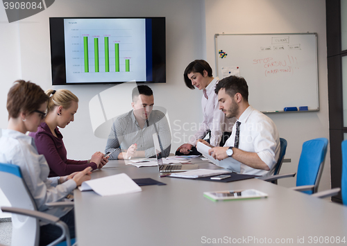 Image of young business people group on team meeting at modern office