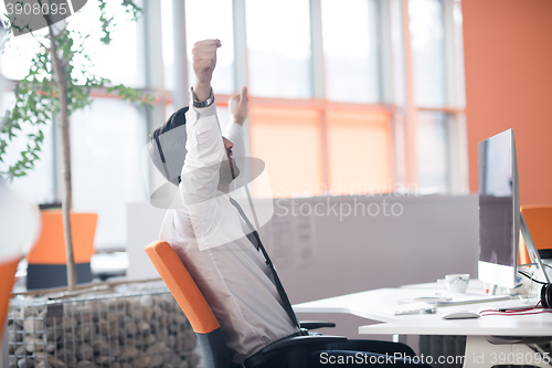 Image of young business man  working on desktop computer