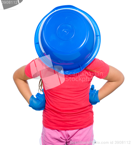 Image of Little girl put a blue bucket on her head
