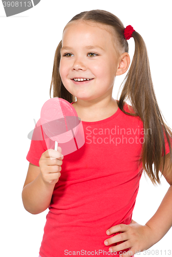 Image of Little girl with lollipop