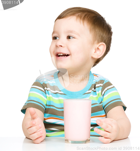 Image of Cute little boy with a glass of milk