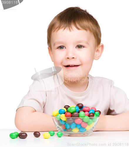 Image of Portrait of a boy with candies