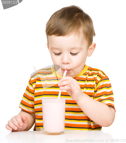 Image of Cute little boy with a glass of milk