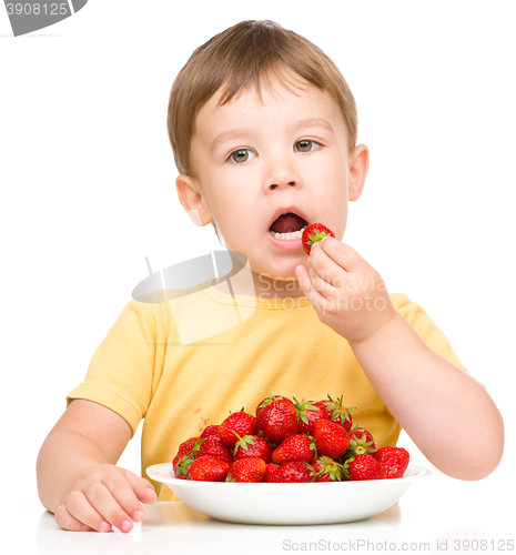 Image of Little boy with strawberries