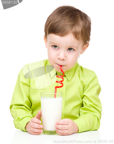 Image of Cute little boy with a glass of milk