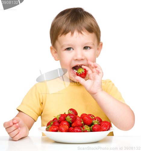 Image of Little boy with strawberries