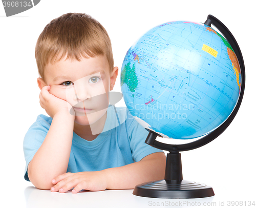 Image of Little boy with a globe