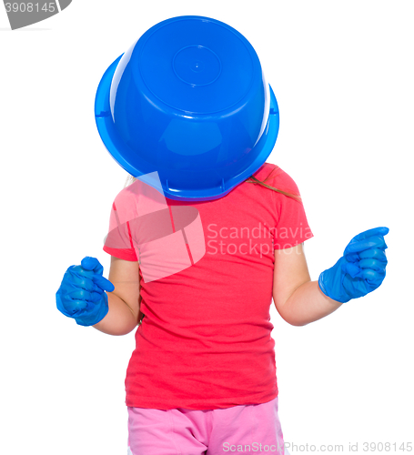 Image of Little girl put a blue bucket on her head