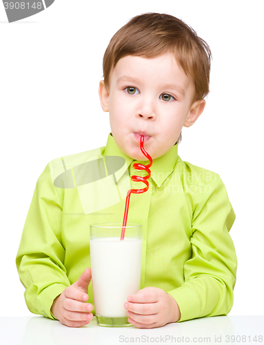 Image of Cute little boy with a glass of milk