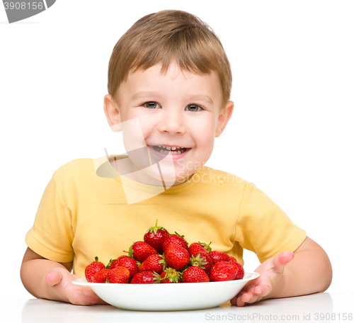 Image of Little boy with strawberries