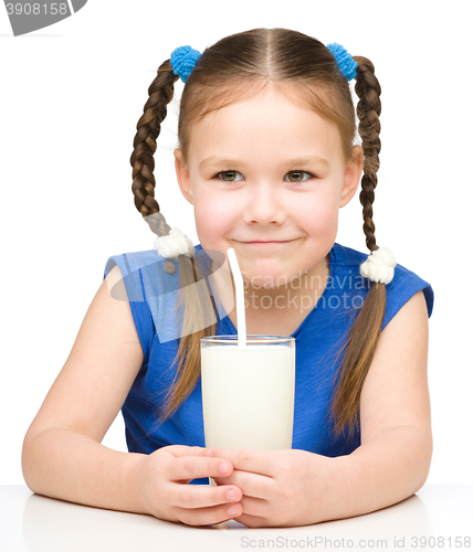 Image of Cute little girl with a glass of milk